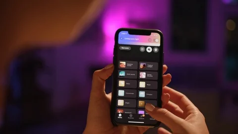 Controlling home lights wirelessly using smartphone / Smart Home Features Stock-Footage 103185213