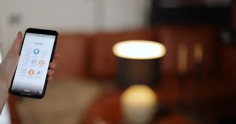 Controlling light with a smart phone Stock Footage 149273152