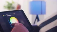 Controlling Smart Home Lights Wirelessly Using An Ipad / Smart Home Lights Stock Footage