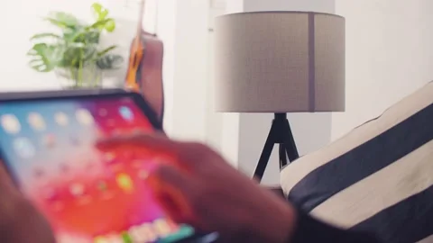 Controlling Smart Home Lights Wirelessly Using An Ipad / Smart Home Lights Stock Footage 131689197