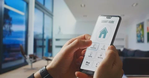 Controlling the temperature of the home using a smart house control using mobile Video stock 128690234