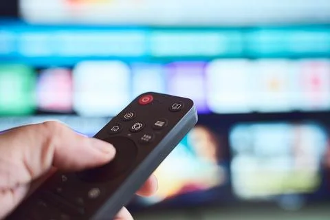Controlling TV with remote Stock Photos