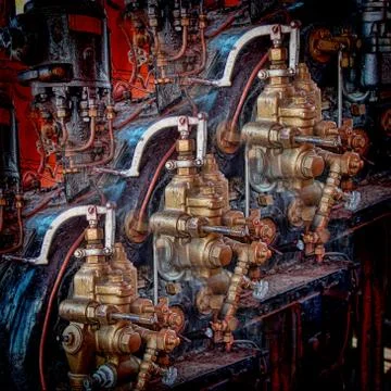 Controls and adjustment levers of a vintage steam engine Stock Photos