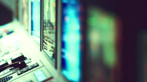Controls and screens at a broadcasting studio in the evening Stock Footage 343573431