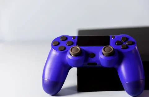 Controls and video game console on light background Stock Photos