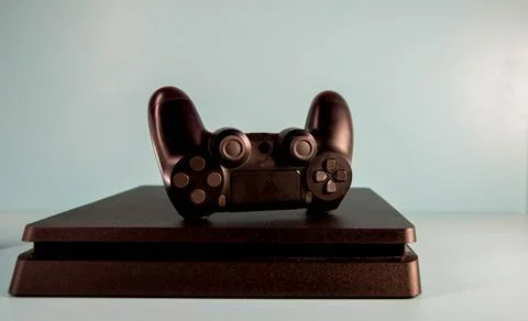 Controls and video game console on light background-12 Stock Photos