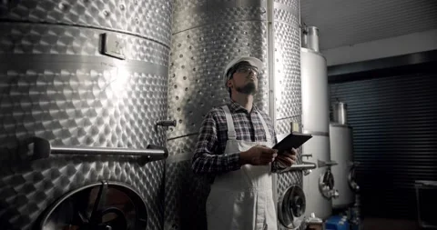 Controls the quality of production equipment in wine factory. Stock Footage 233021384