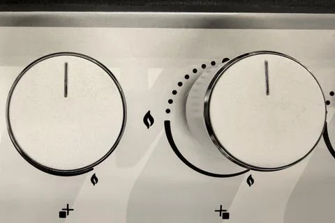 Controls set for a cozy kitchen cooking experience on a chilly evening Stock Photos