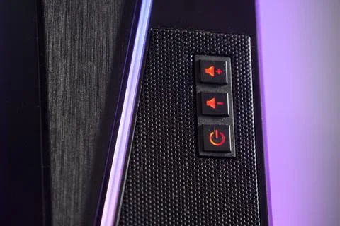 Controls for sound and power on a computer case with LED lighting Stock Photos