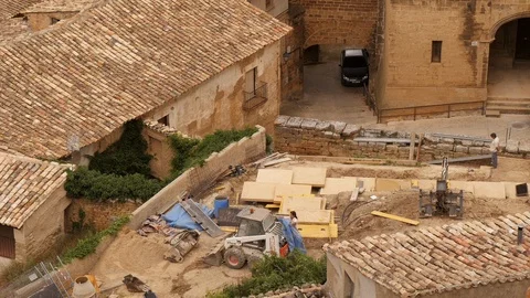 Contruction work and machinery in small Spanish village Stock Footage 98162481