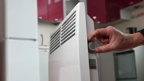 Convector heater has an adjustable thermostat dial which allows you to control Stock Footage 234804450