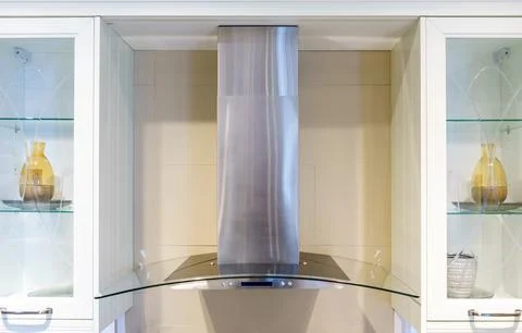 Convenient operation kitchen hood with toggle modes in the new modern kitchen Stock Photos