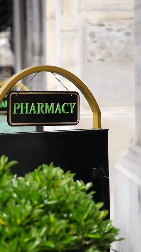 Convenient pharmacy location near bustling city street Stock Footage 308284092