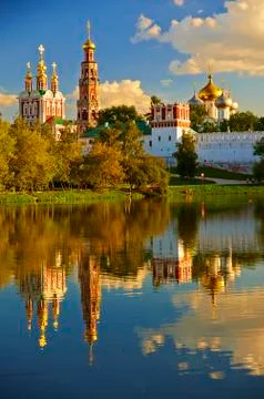Convent by a pond. Stock Photos
