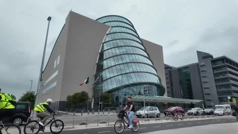 The Convention Centre Dublin - Cyclist and Pedestrians at Modern Landmark. Stock Footage 338223217