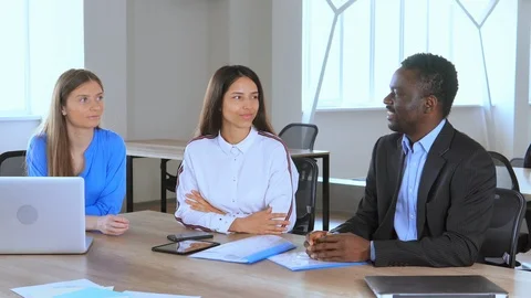 Conversation between colleagues in office Stock Footage 111759622