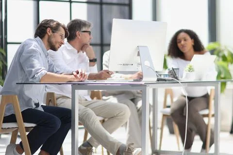 Conversation between managers and employees in the office Stock Photos