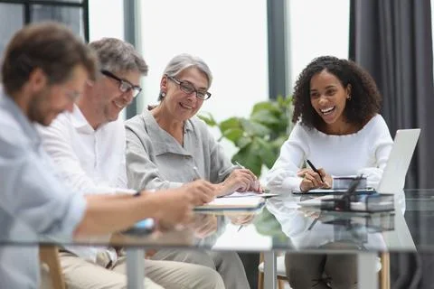 Conversation between managers and employees in the office at the table Stock Photos