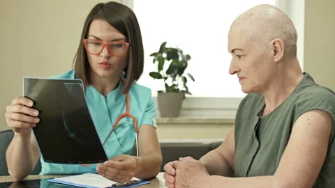 Conversation between an oncologist and a patient after chemotherapy. Stock Footage 164302371