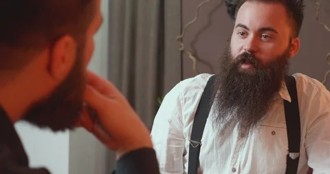 Conversation between two bearded friends over a glass of alcohol Stock Footage 103934830