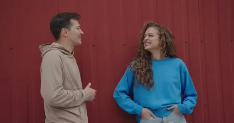 A conversation between two friends on the street. Video stock 273367605