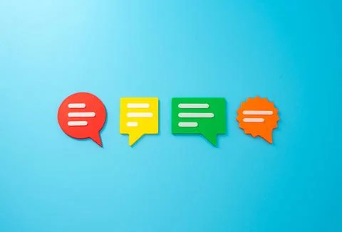 Conversation clouds on blue background. Different points of view, opinions an 库存照片