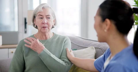 Conversation, neck pain and caregiver he... | Stock Video | Pond5