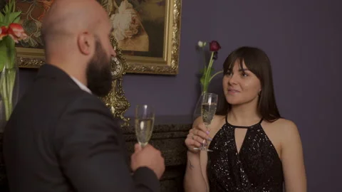 Conversation of two young people with glasses of champagne in their hands and Vídeos de archivo 143593501