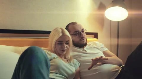 Conversations and problem solving in modern family. Husband and wife in bed Stock Footage 230313268