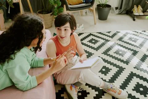 Conversing and Writing Notes on Geometric Black and White Rug Stock Photos