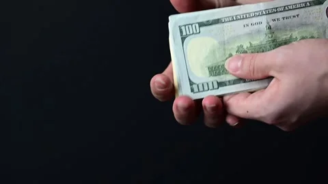 Conversion of hundred dollar bills, business people count money Stock Footage 253783324