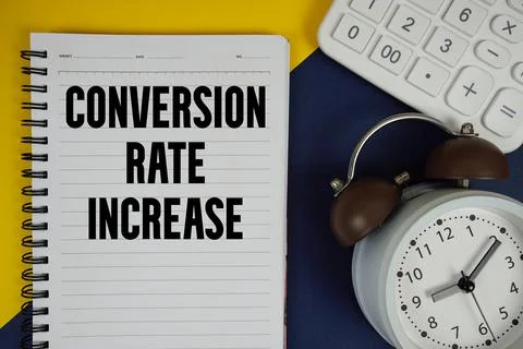 Conversion Rate Increase text written on notepad with calculator and alarm .. 스톡 사진