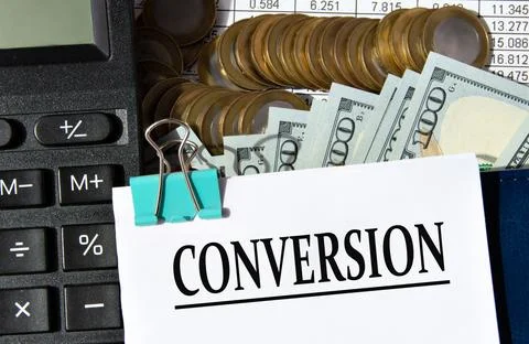 CONVERSION - word on a white sheet against the background of a calculator, .. Stock Photos