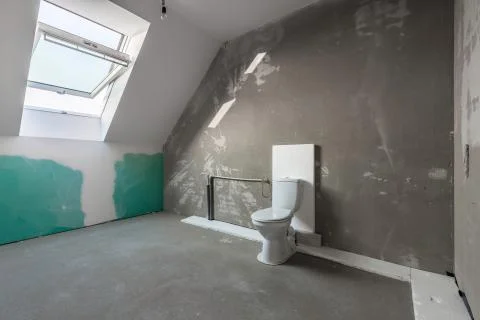 Convert an attic to a bathroom Stock Photos