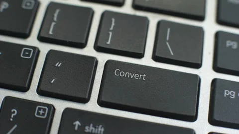 Convert button on computer keyboard, female hand fingers press key Stock Footage 97827283