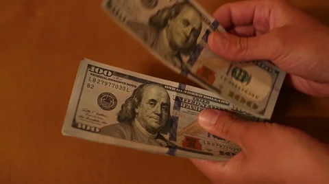 Convert Dollars in the Hands of Stock Footage 62871552