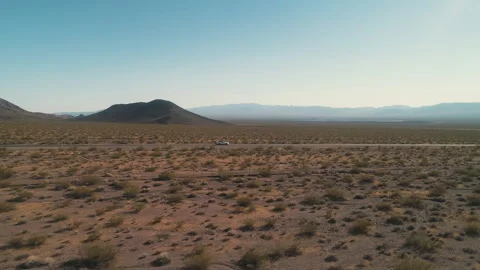 Convertible Driving on Isolated Desert Road Near Las Vegas Stock Footage 325983772