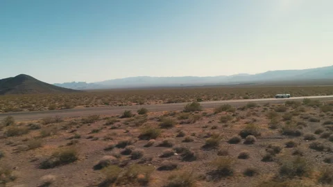 Convertible Driving Through Vast Desert Landscape Stock Footage 327339752