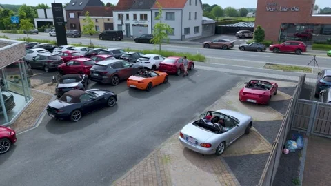 Convertible Turning Through Parking Lot at Sports Car Gathering Stock Footage 340535847