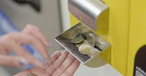 Converting from banknotes to coins to prepare for use with vending machines. Stock Footage 222619078
