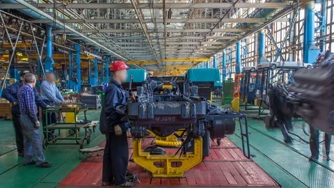 Conveyor assembly stage the body of tractor at factory timelapse Stock Footage 69872007