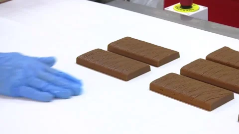 Conveyor belt with candy close-up Stock Footage 313443976