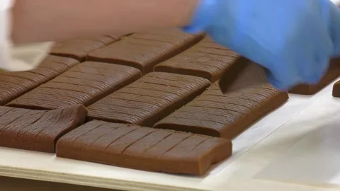 Conveyor belt with candy close-up Video stock 313443987