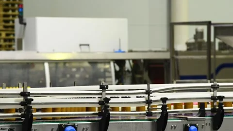 A conveyor belt with cans of mashed vegetables moving along it. Stock Footage 339913442