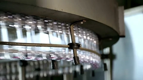Conveyor belt with Empty bottles for drinking water at a modern beverage plant Stock Footage 334587790