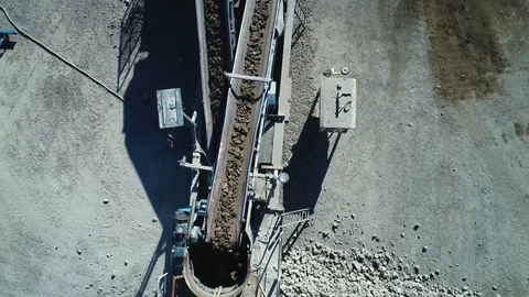 Conveyor belt in mining pit, aerial view. Stock Footage
