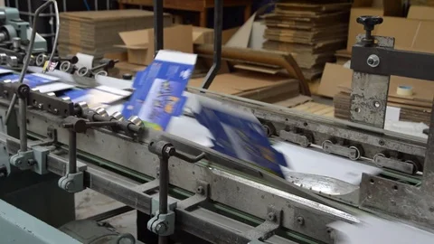 Conveyor Belt of a packaging folding machine on a factory production line Stock Footage 77647367