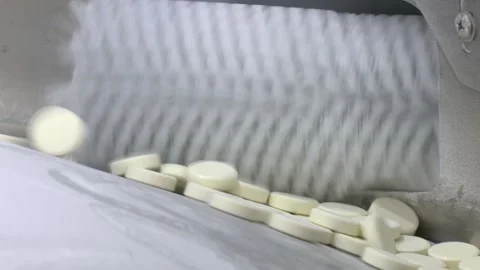 Conveyor belt with sweets on it. Production of sweets from dry milk. Stock Footage 336863041