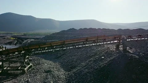 Conveyor belt is used for the washing of the golden ore at the open pit mine Stock Footage