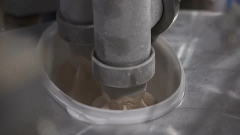 Conveyor filling white plastic boxes with chocolate ice cream Stock Footage 165269986